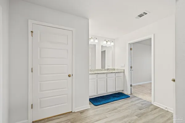 a view of an entryway with wooden floor