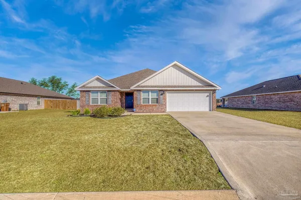 a front view of a house with a garage