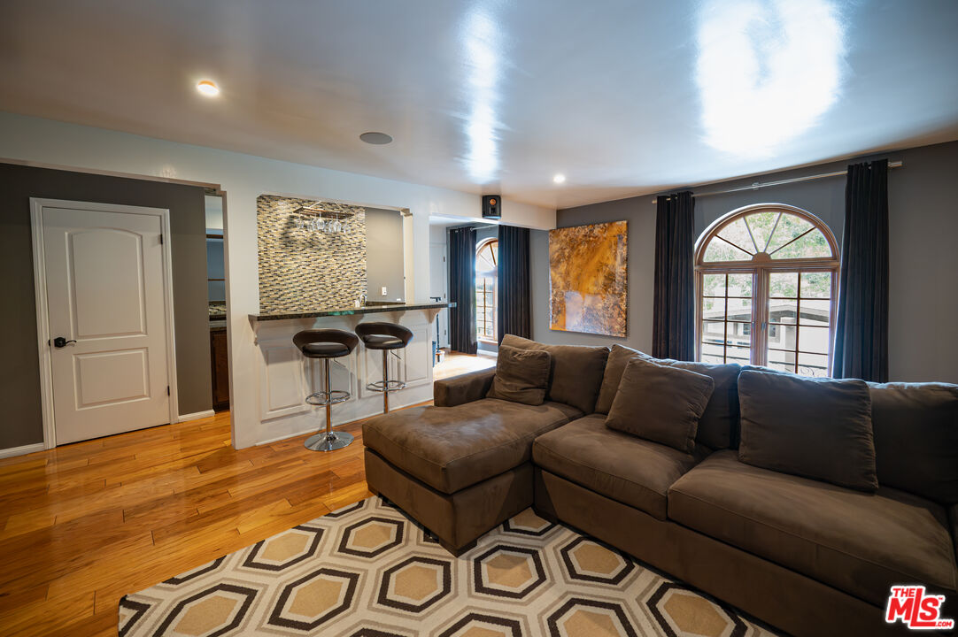 503 North Greencraig Road Los Angeles, CA 90049 - Photo 19 of 59 a living room with furniture and a large window
