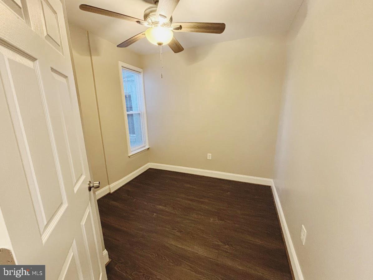 1721 North Bond Street Baltimore, MD 21213 - Photo 11 of 21 an empty room with wooden floor fan and windows