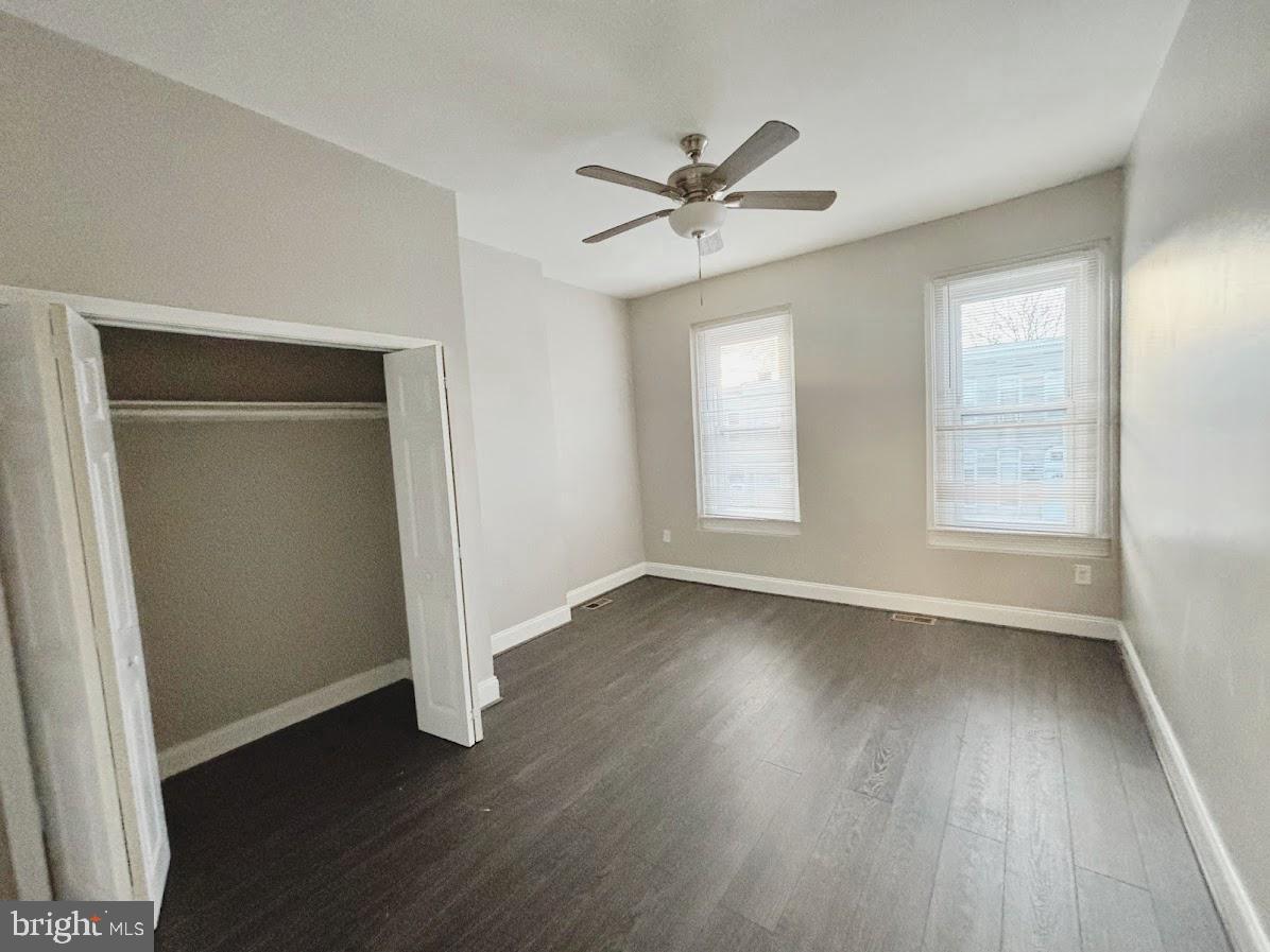 1721 North Bond Street Baltimore, MD 21213 - Photo 13 of 21 an empty room with wooden floor closet and windows