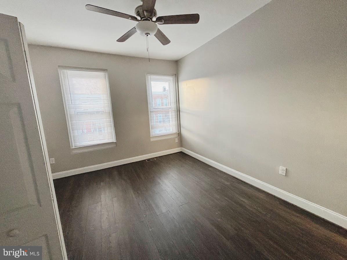 1721 North Bond Street Baltimore, MD 21213 - Photo 14 of 21 an empty room with wooden floor fan and windows