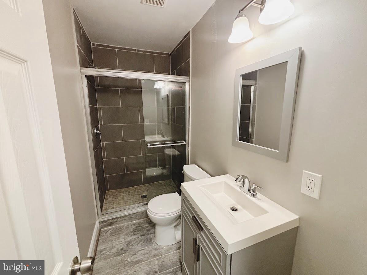 1721 North Bond Street Baltimore, MD 21213 - Photo 17 of 21 a bathroom with a sink toilet and shower