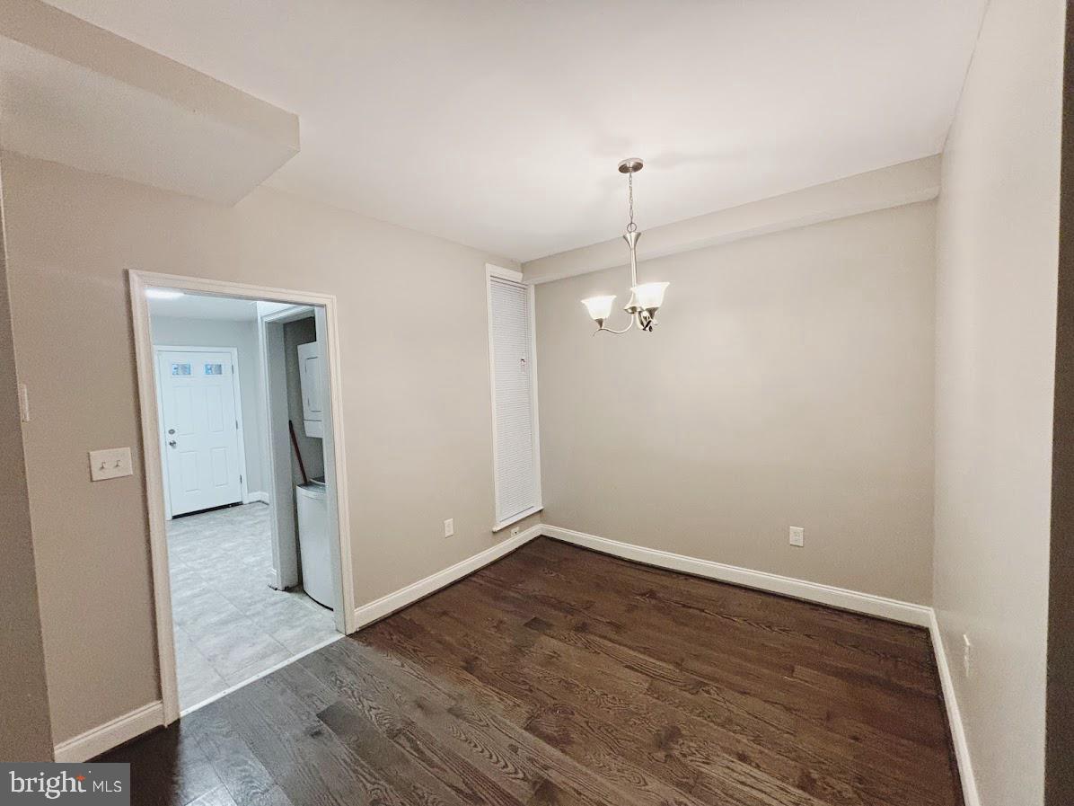 1721 North Bond Street Baltimore, MD 21213 - Photo 4 of 21 wooden floor in an empty room with a window