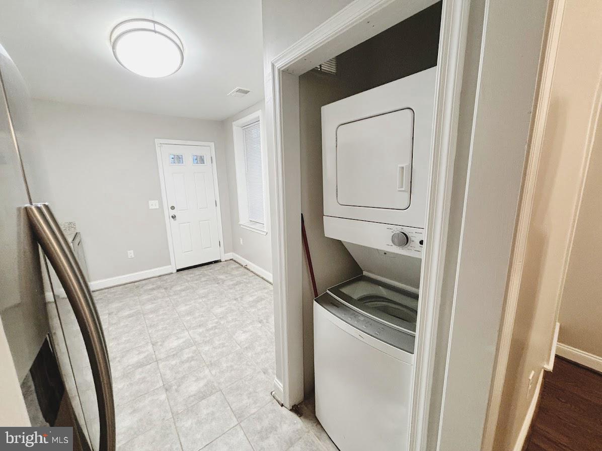 1721 North Bond Street Baltimore, MD 21213 - Photo 7 of 21 a kitchen with a refrigerator and cabinets