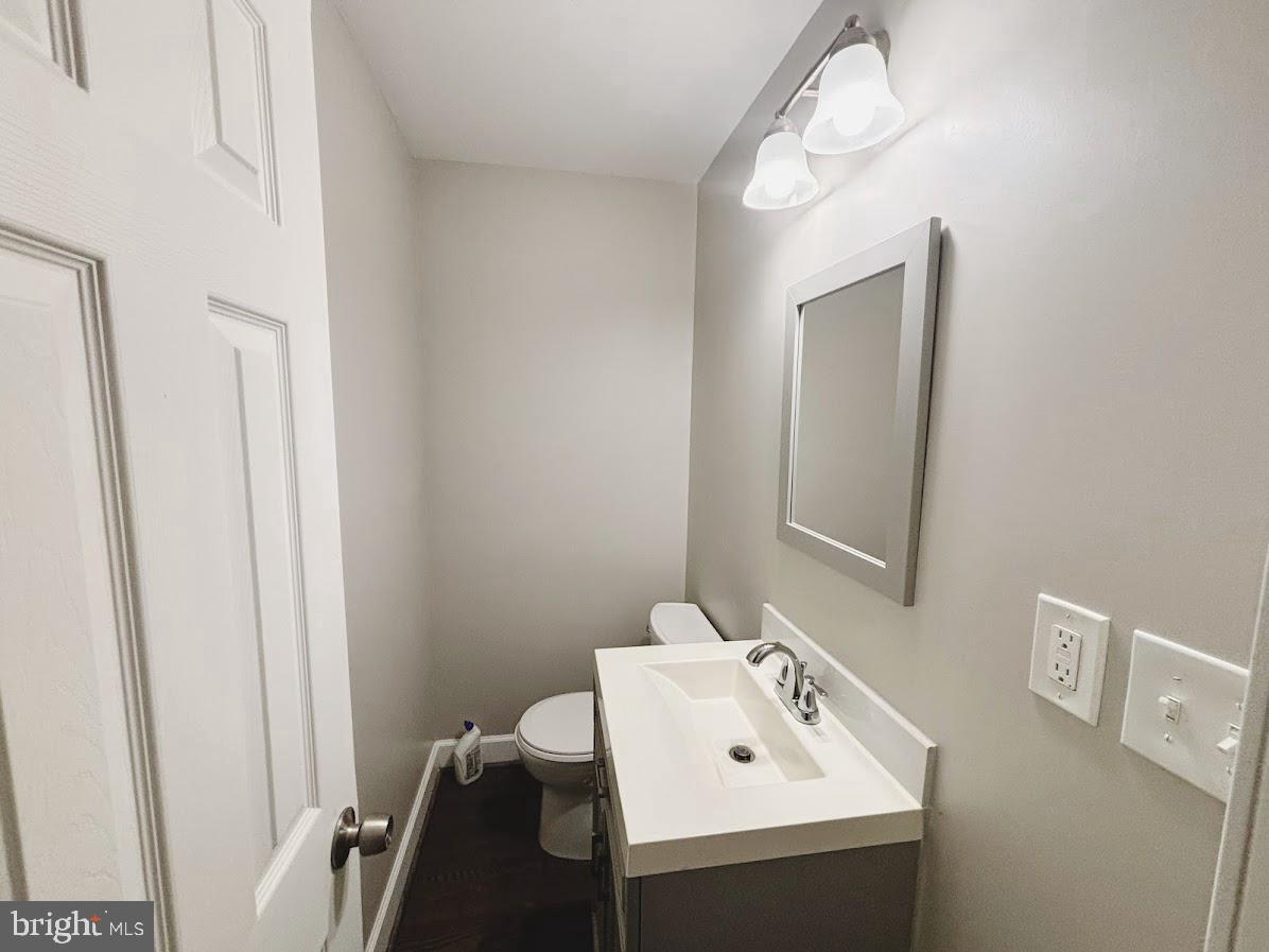 1721 North Bond Street Baltimore, MD 21213 - Photo 8 of 21 a bathroom with a sink a mirror and vanity