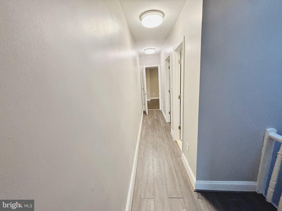 1721 North Bond Street Baltimore, MD 21213 - Photo 9 of 21 a view of a hallway with wooden floor