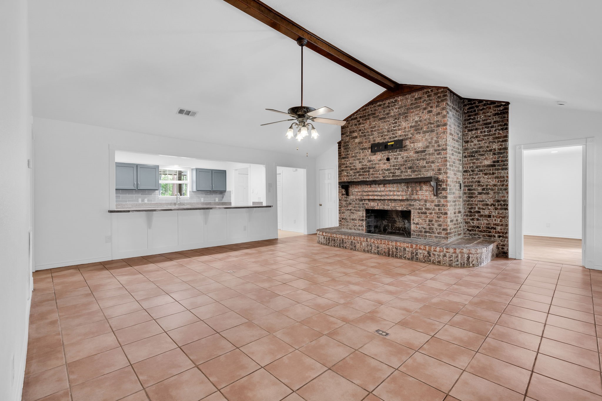 19811 Sagging Oaks Drive Spring, TX 77388 - Photo 15 of 35 a view of an empty room with a fireplace and a window
