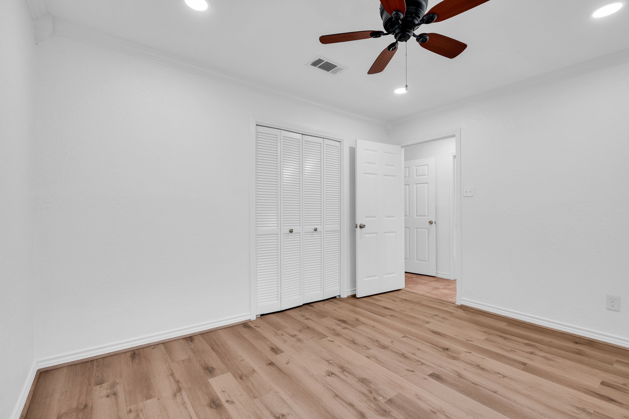 19811 Sagging Oaks Drive Spring, TX 77388 - Photo 22 of 35 a view of an empty room and wooden floor
