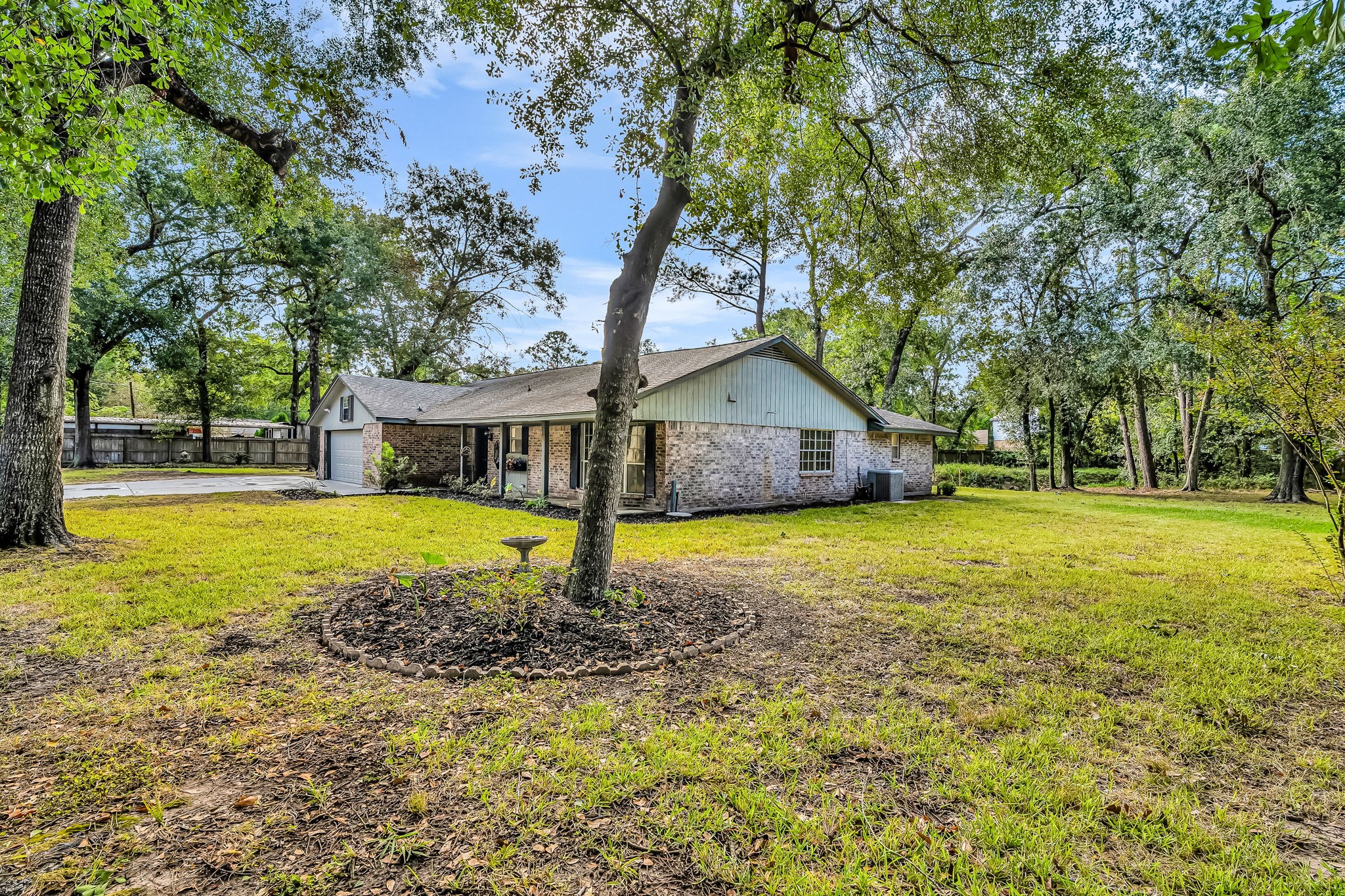 19811 Sagging Oaks Drive Spring, TX 77388 - Photo 30 of 35 a front view of house with yard and swimming pool