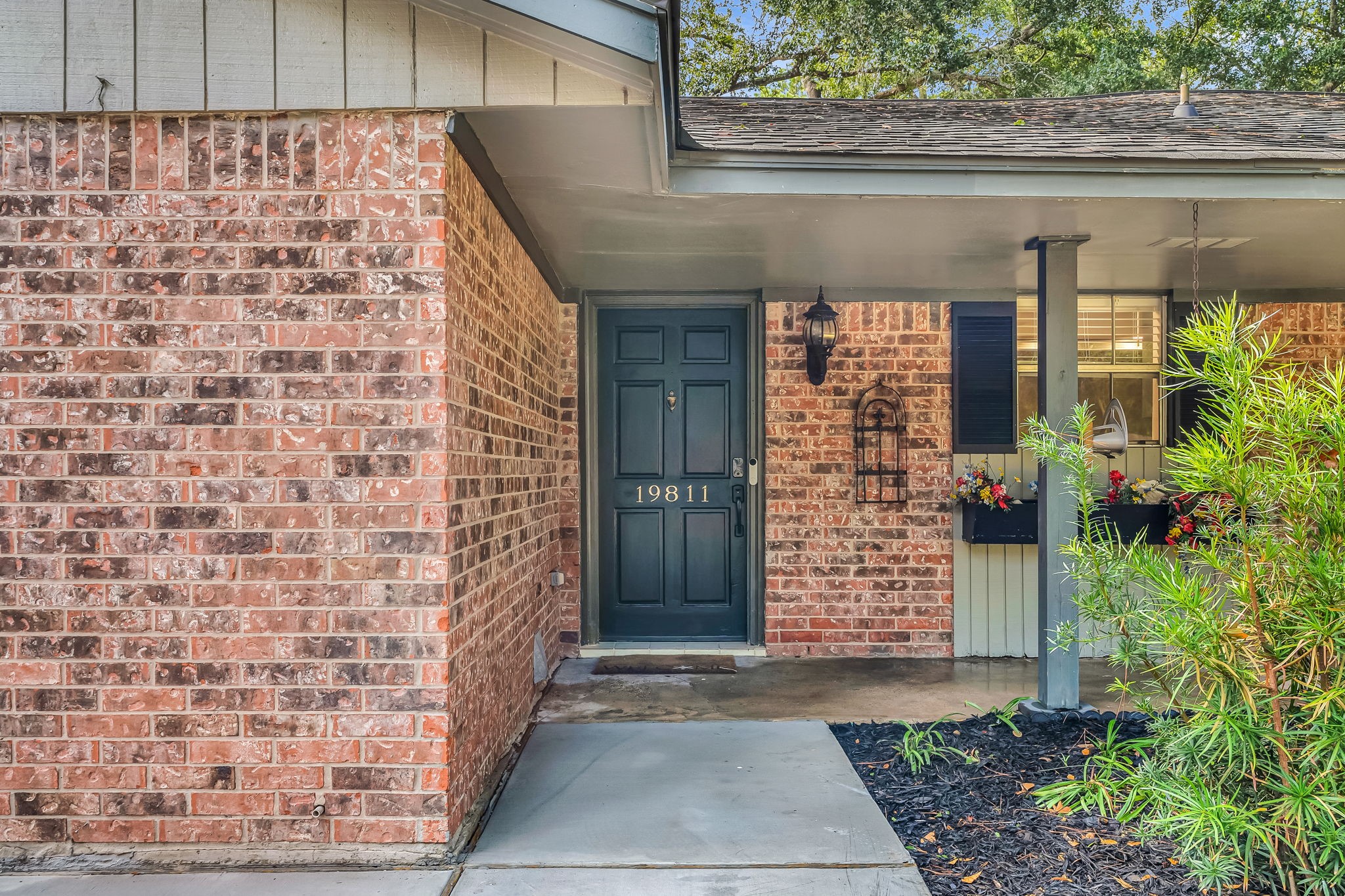 19811 Sagging Oaks Drive Spring, TX 77388 - Photo 5 of 35 a front view of a house with a garage
