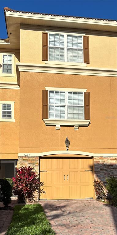 5633 Blackfin Drive New Port Richey, FL 34652 - Photo 1 of 46 a view of a balcony with a floor to ceiling window and wooden fence