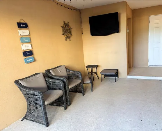 a bedroom with a bed and painting on the wall