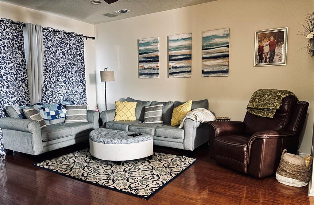 5633 Blackfin Drive New Port Richey, FL 34652 - Photo 17 of 46 a living room with furniture and a rug