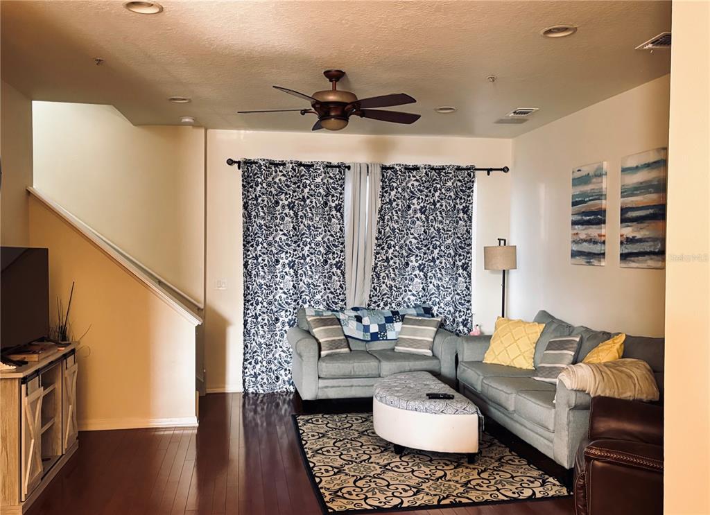 5633 Blackfin Drive New Port Richey, FL 34652 - Photo 18 of 46 a living room with furniture and a flat screen tv