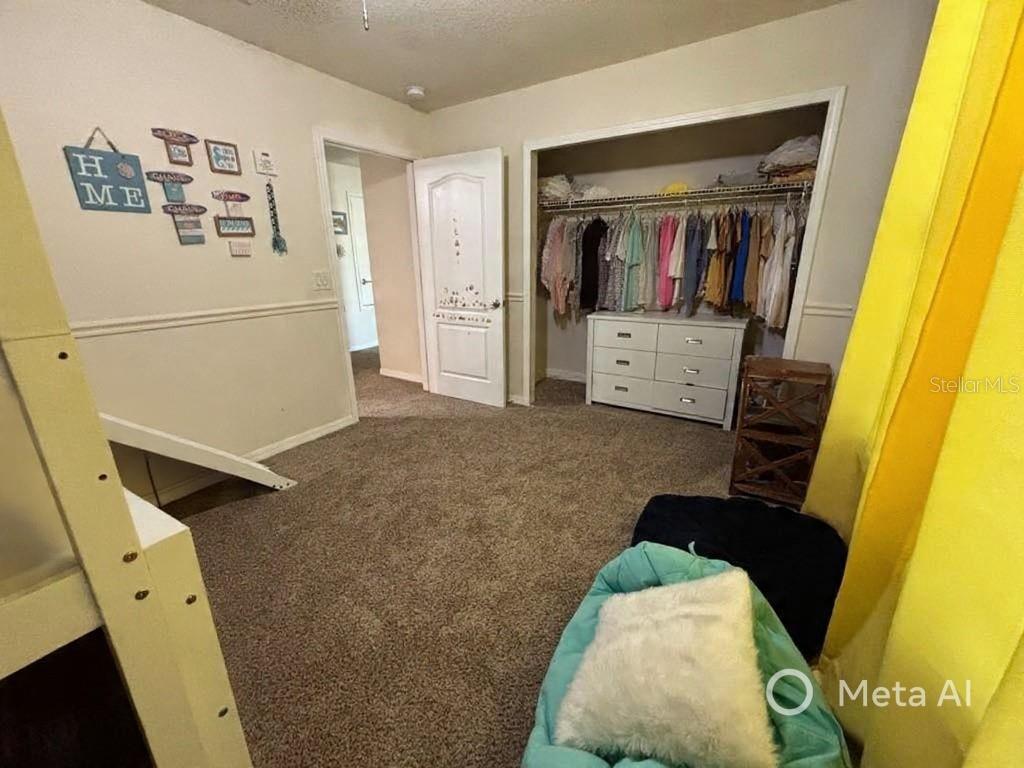 5633 Blackfin Drive New Port Richey, FL 34652 - Photo 28 of 46 a view of walk in closet with clothes and refrigerator