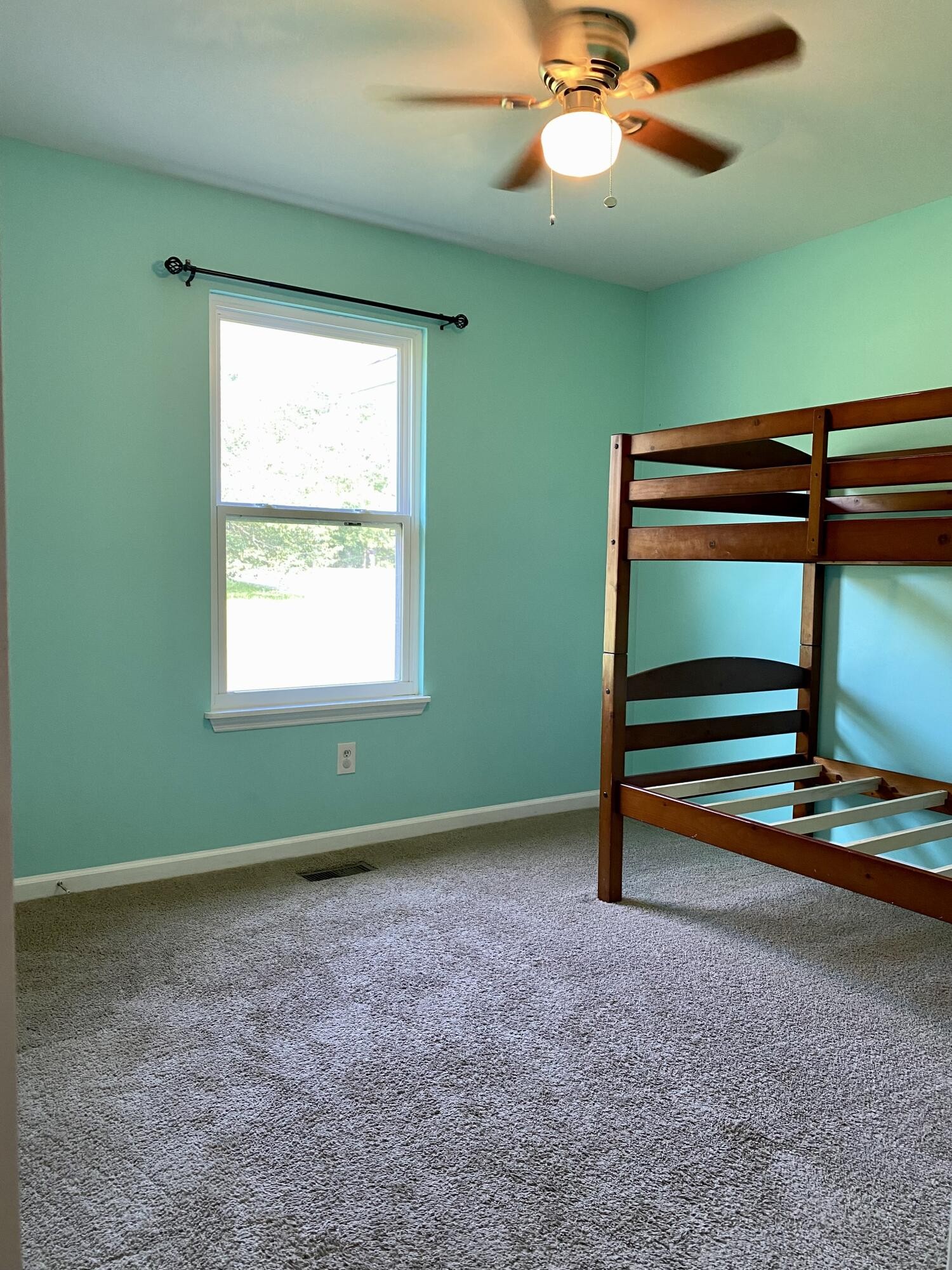 1724 Southeast Hunt Road Cleveland, TN 37323 - Photo 15 of 28 a room with a window and a ceiling fan