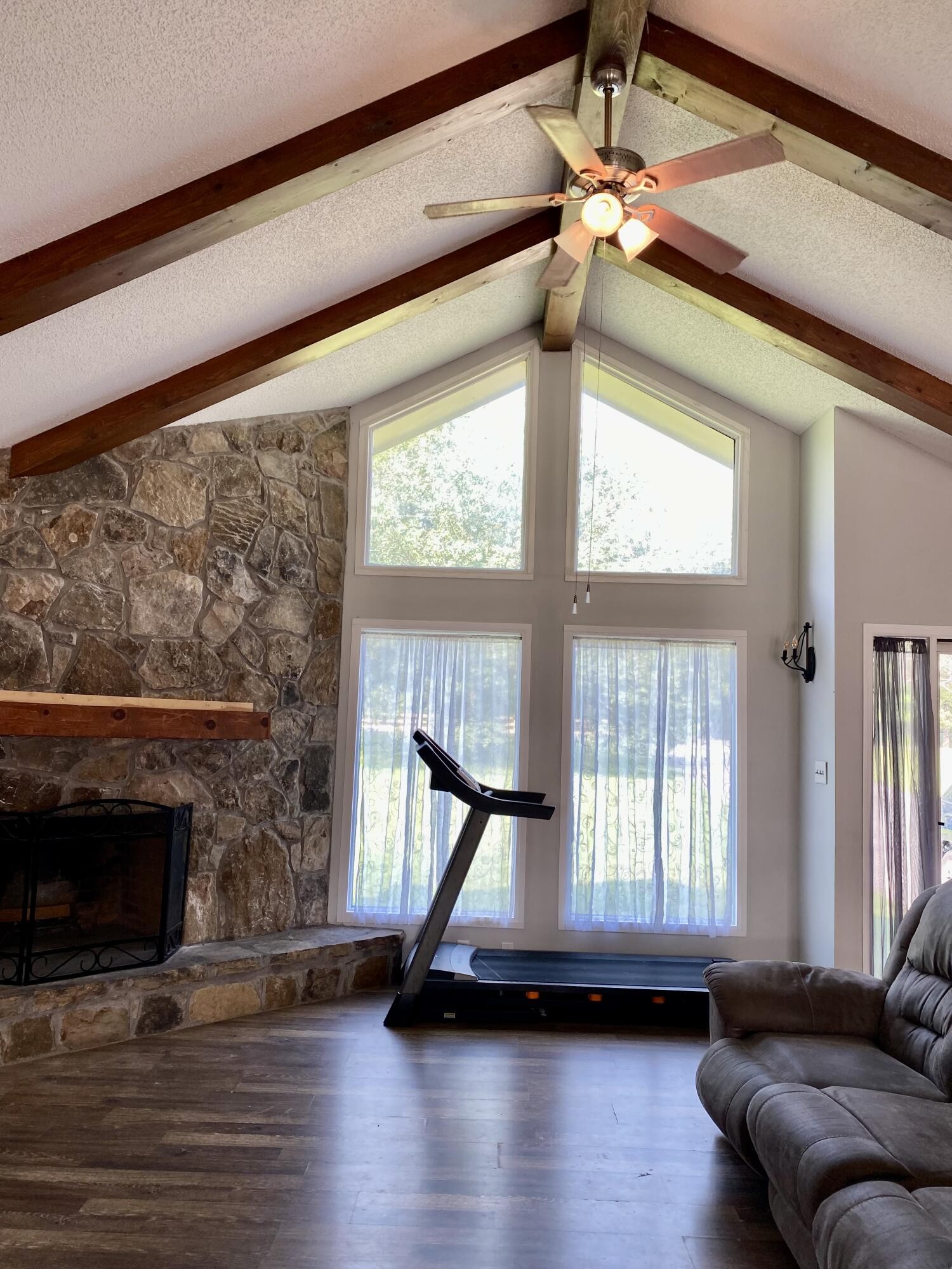 1724 Southeast Hunt Road Cleveland, TN 37323 - Photo 8 of 28 a living room with furniture and a fireplace