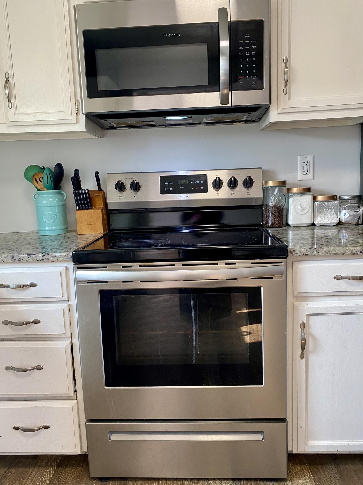 1724 Southeast Hunt Road Cleveland, TN 37323 - Photo 10 of 28 a stove top oven sitting inside of a kitchen and white stove