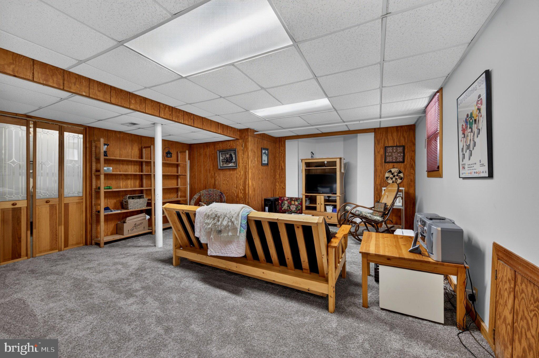 128 Boncouer Road Cheltenham, PA 19012 - Photo 24 of 31 Cozy basement retreat with warm wood tones.