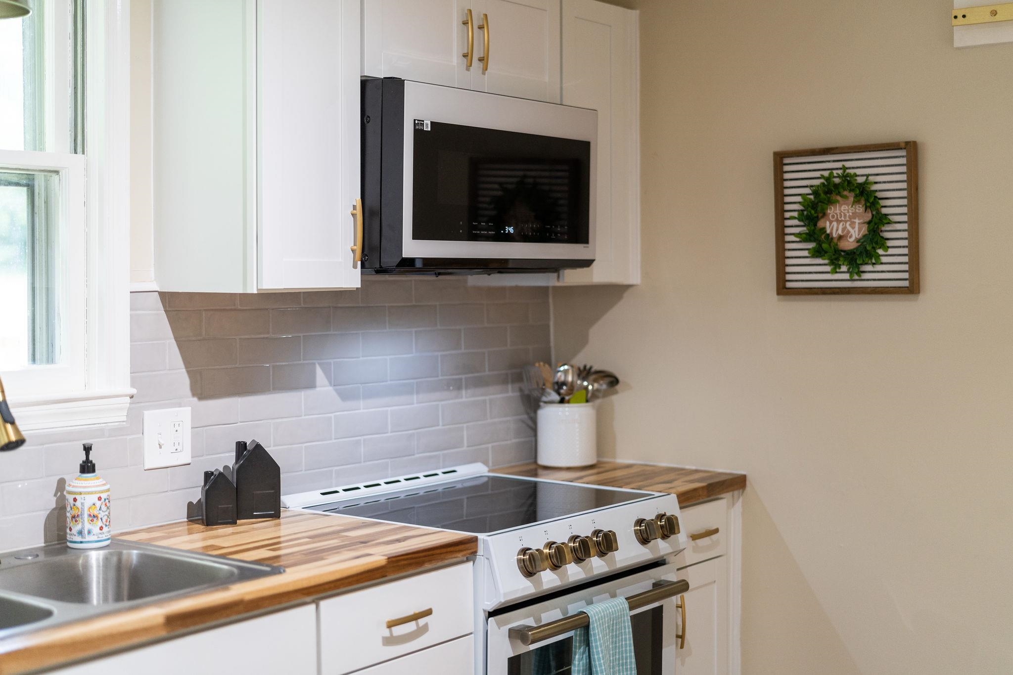 2302 Lee Highway Mount Sidney, VA 24467 - Photo 18 of 75 a kitchen with a stove and a sink