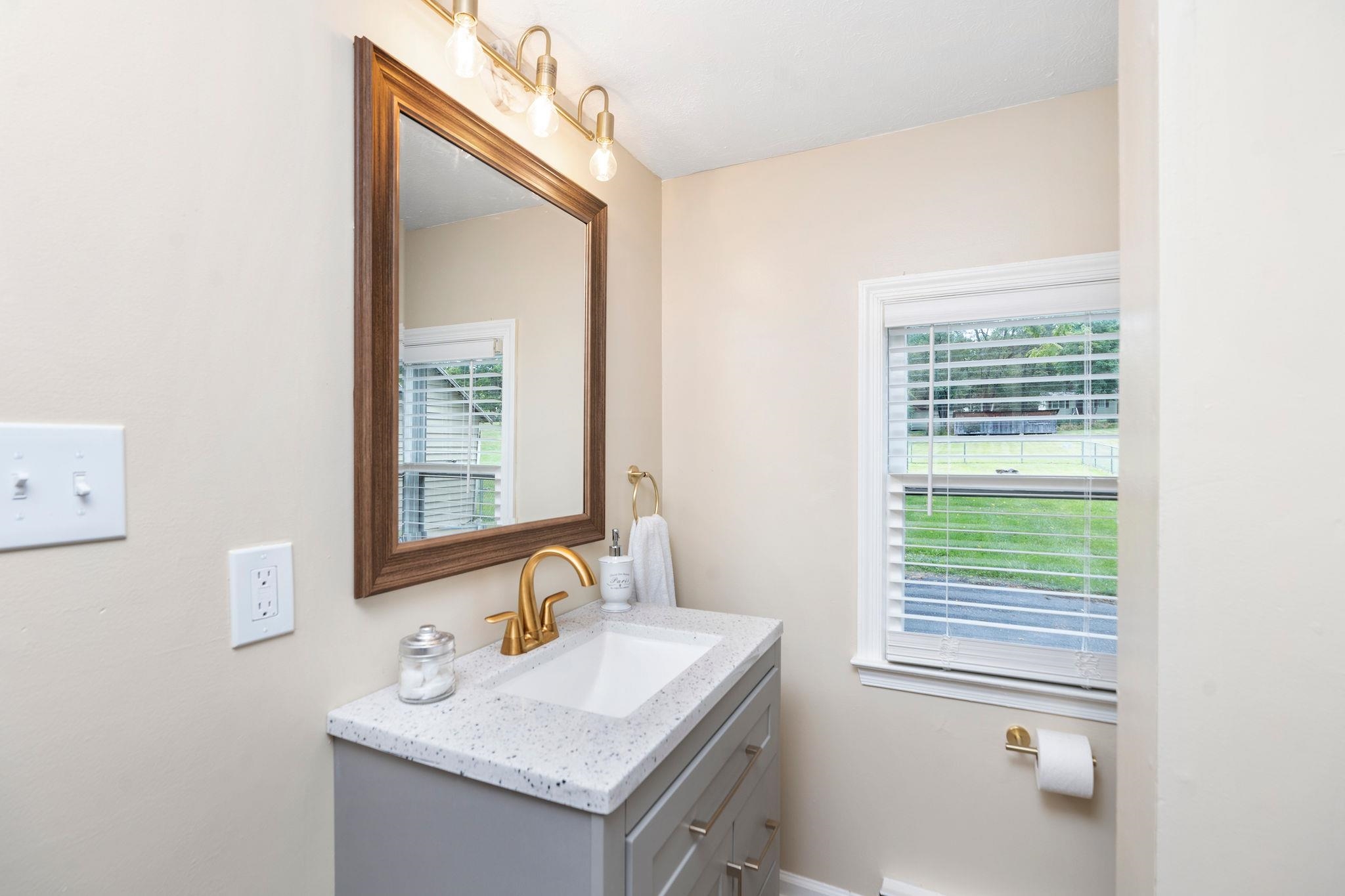 2302 Lee Highway Mount Sidney, VA 24467 - Photo 29 of 75 a bathroom with a sink a vanity and a mirror