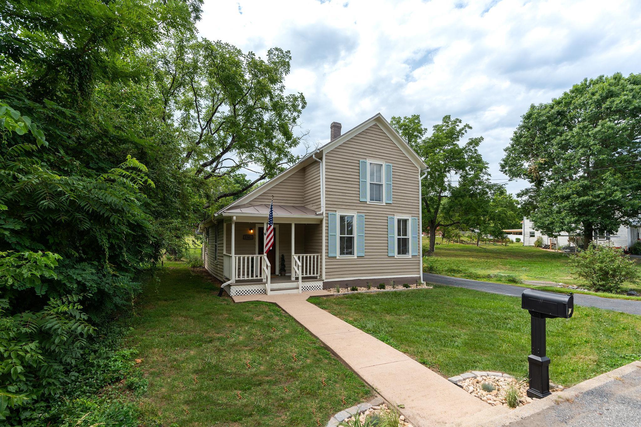 2302 Lee Highway Mount Sidney, VA 24467 - Photo 61 of 75 a front view of house with a garden and patio