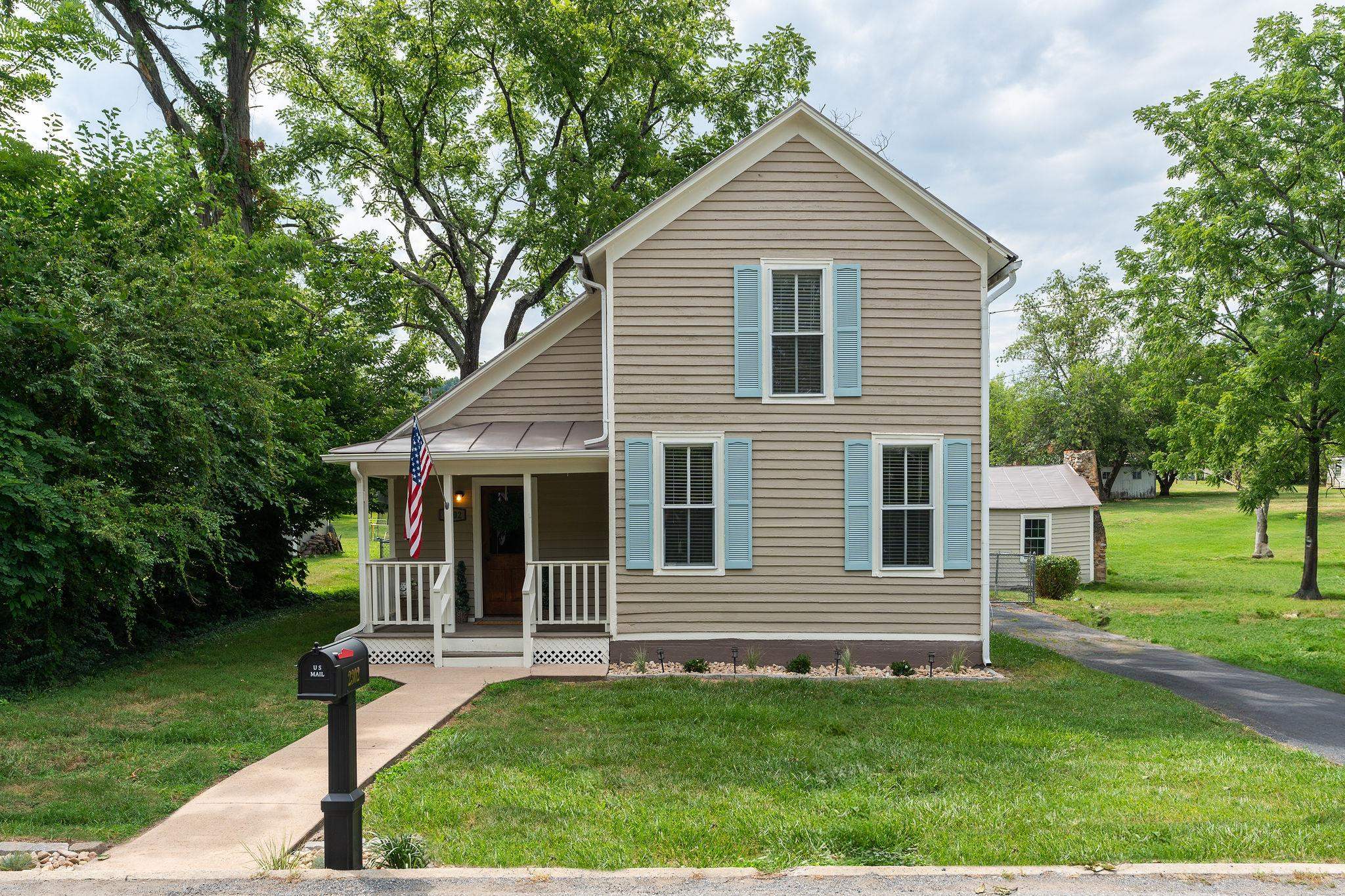 2302 Lee Highway Mount Sidney, VA 24467 - Photo 63 of 75 a view of a house with a yard and a large tree