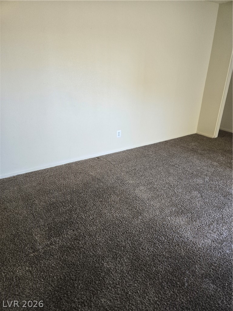 1388 East Desert Inn Road, Unit 2 Las Vegas, NV 89169 - Photo 16 of 23 This living area features a clean wall next to plush carpeting.