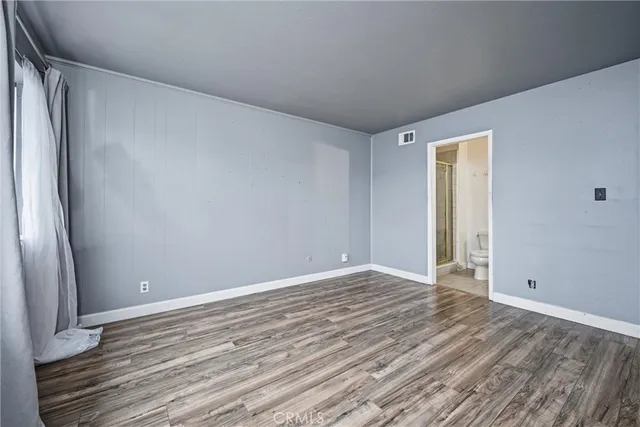 a bathroom with a toilet a sink and shower