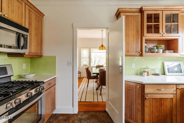 a kitchen with a stove and a microwave