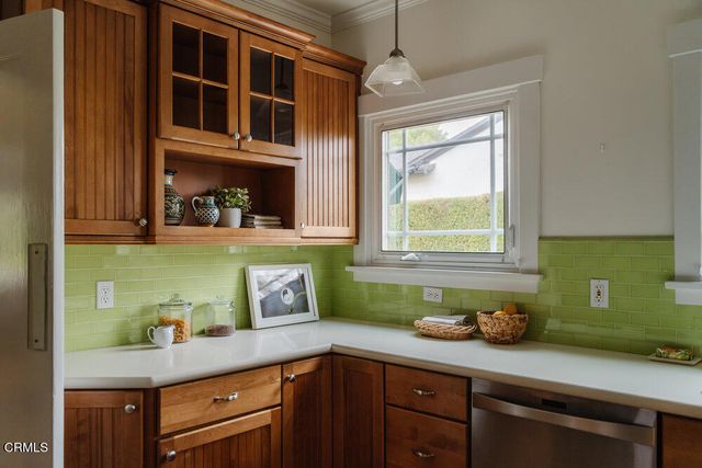 a kitchen with a sink and cabinets