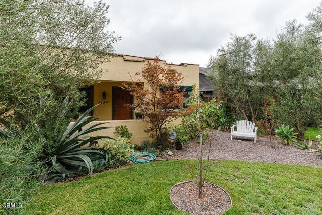 a house view with a garden space