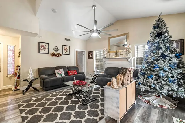 a living room with furniture and a fireplace
