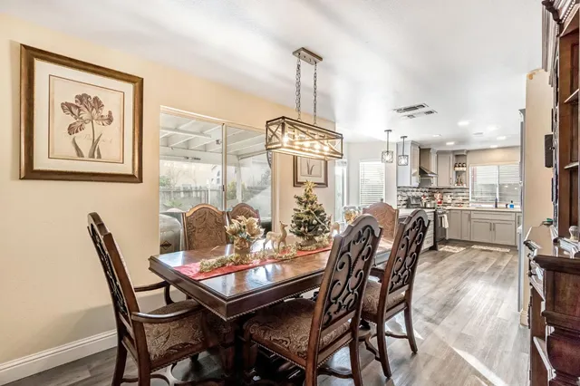 a dining room with furniture and window