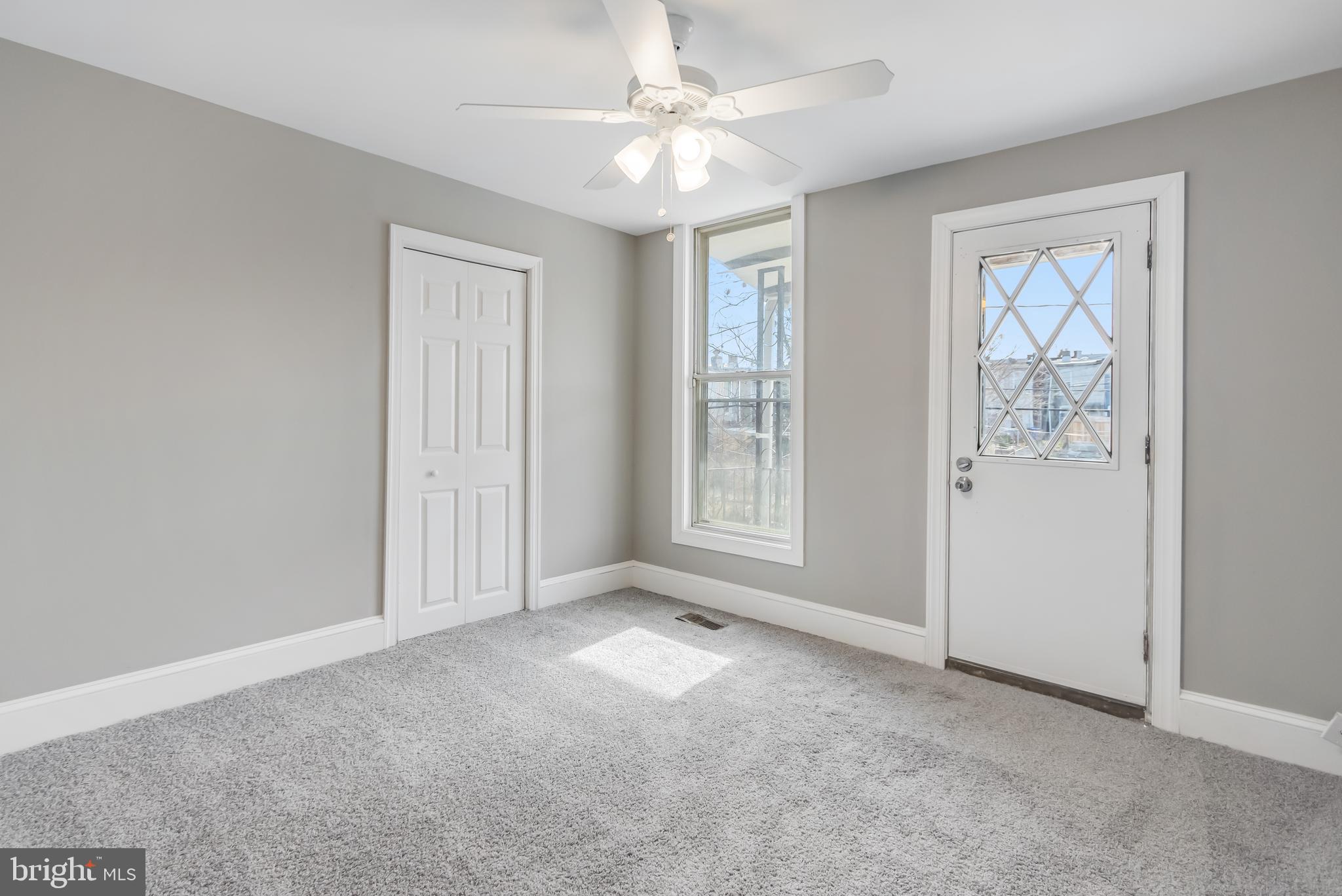 2817 Winchester Street Baltimore, MD 21216 - Photo 16 of 29 an empty room with windows and closet