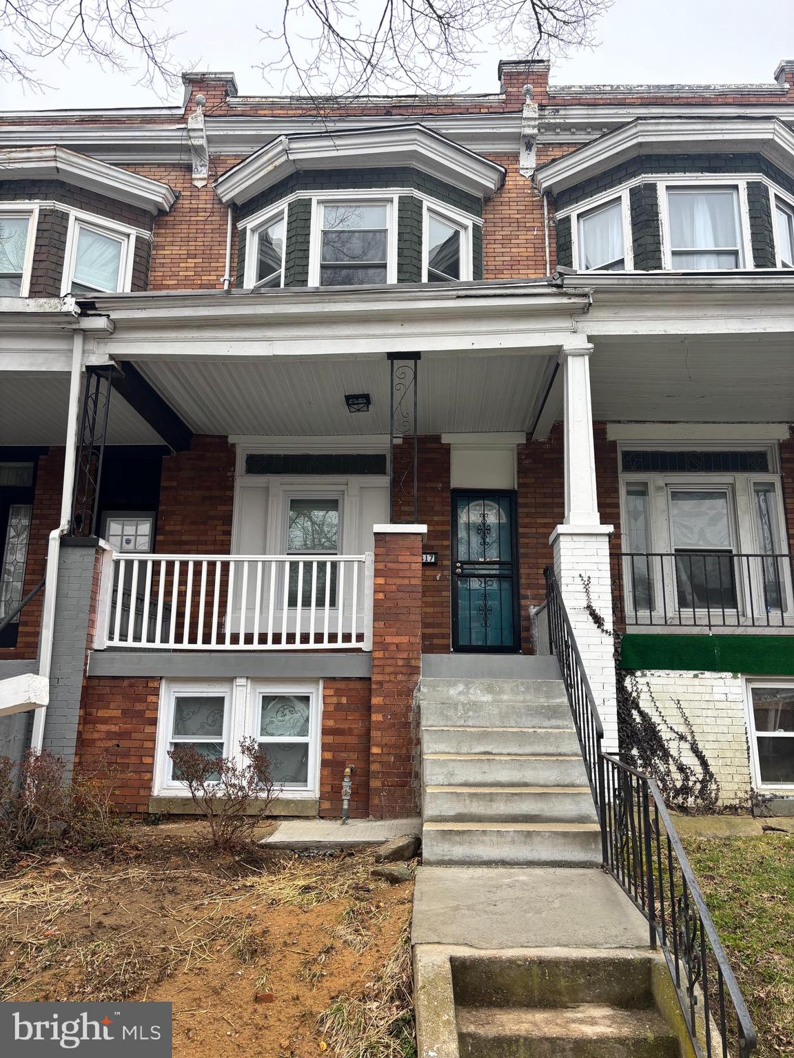 2817 Winchester Street Baltimore, MD 21216 - Photo 2 of 29 front view of a house with a porch