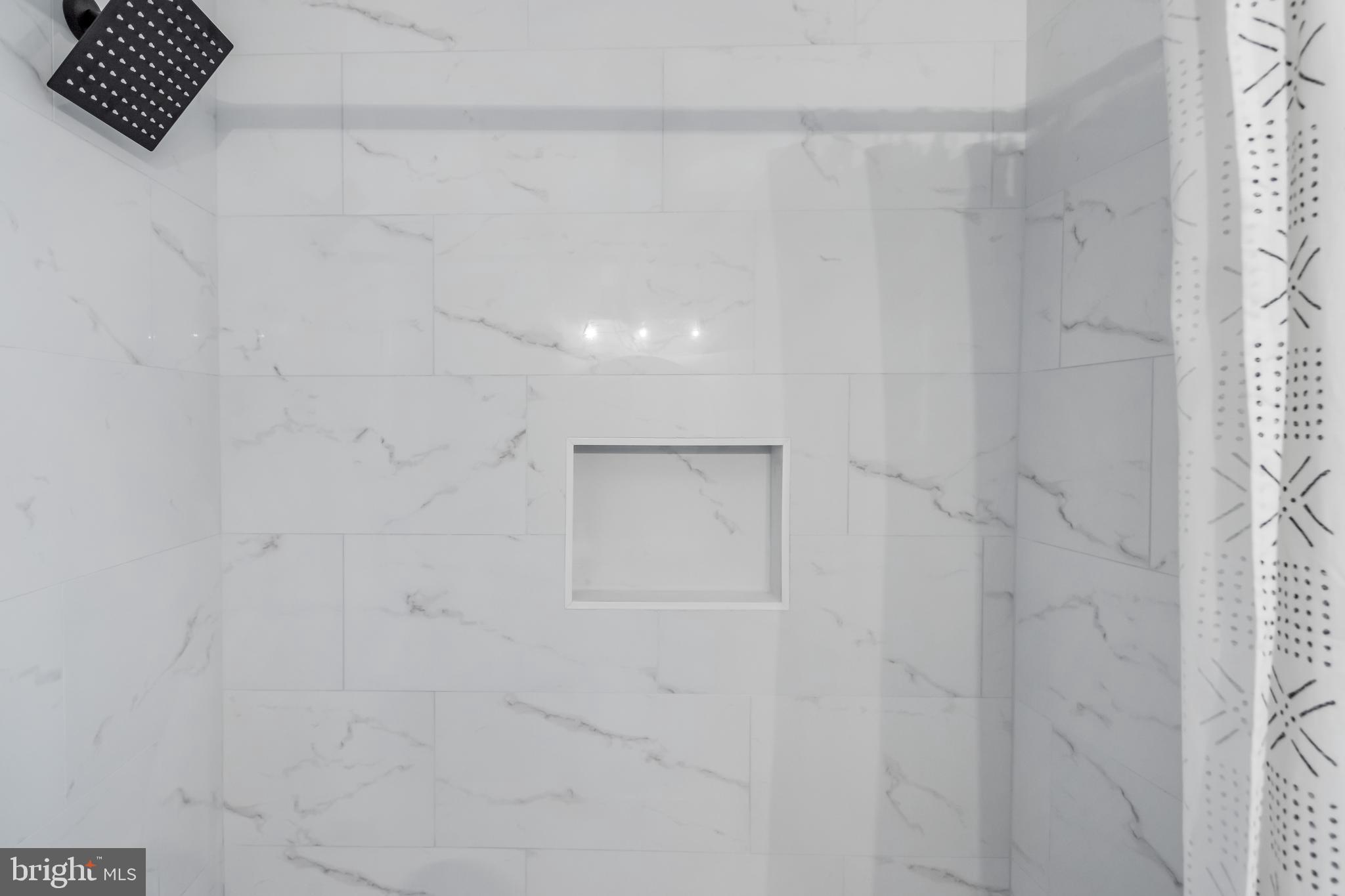2817 Winchester Street Baltimore, MD 21216 - Photo 23 of 29 a bathroom with a shower