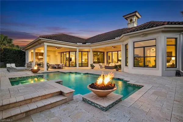 a front view of house with outdoor seating yard and outdoor seating