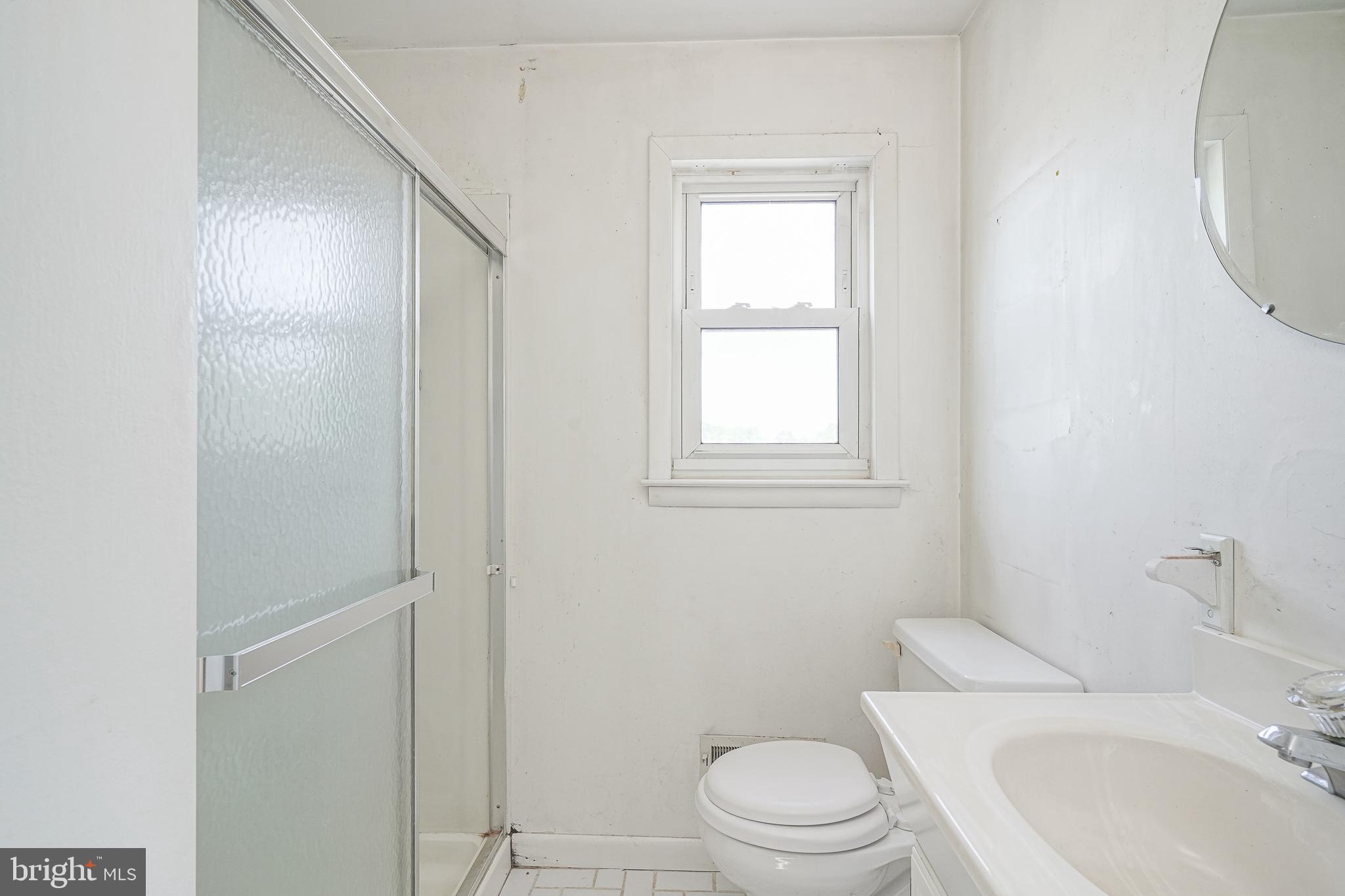 152 Kelly Driver Road Laurel Springs, NJ 08021 - Photo 26 of 30 a white toilet sitting next to a bathroom sink