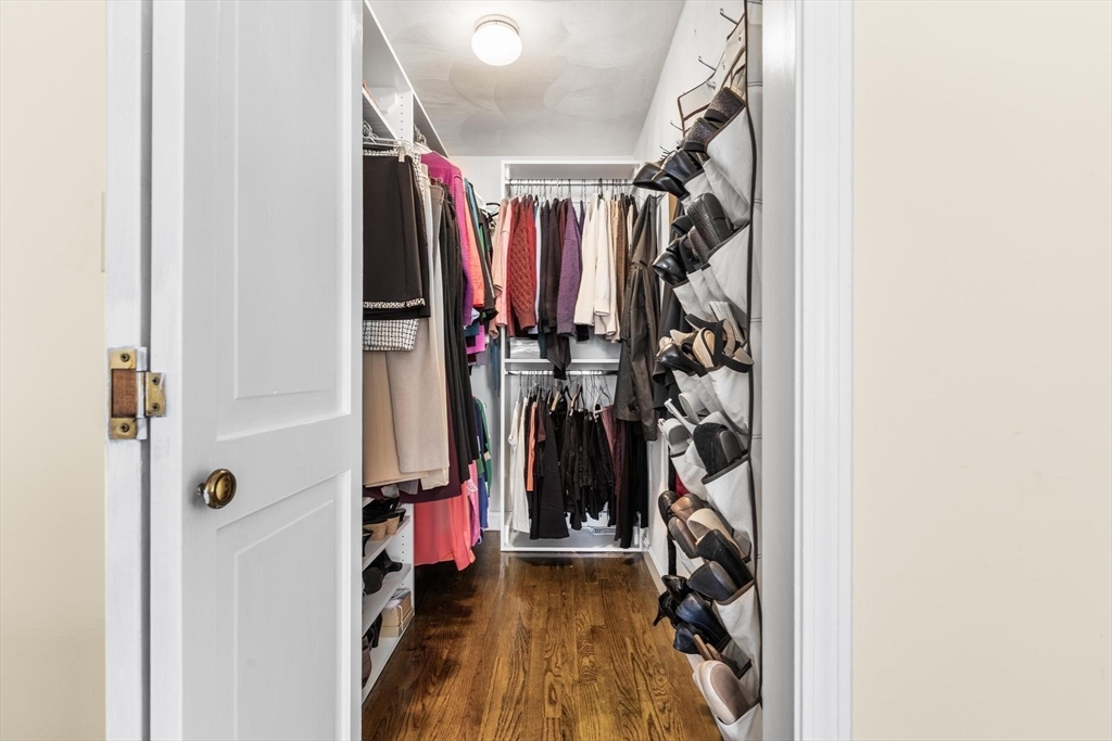 68 Sanborn Lane Reading, MA 01867 - Photo 19 of 42 a view of walk in closet with clothes
