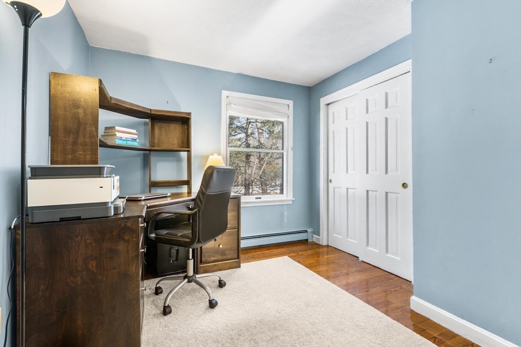 68 Sanborn Lane Reading, MA 01867 - Photo 25 of 42 a view of a workspace with furniture and a window