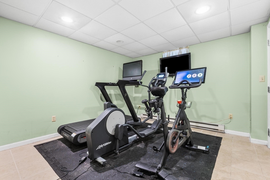 68 Sanborn Lane Reading, MA 01867 - Photo 35 of 42 a view of a room with gym equipment