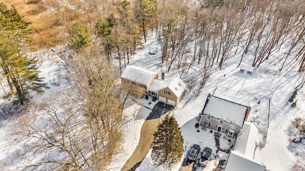 68 Sanborn Lane Reading, MA 01867 - Photo 41 of 42 a view of a house with a large tree