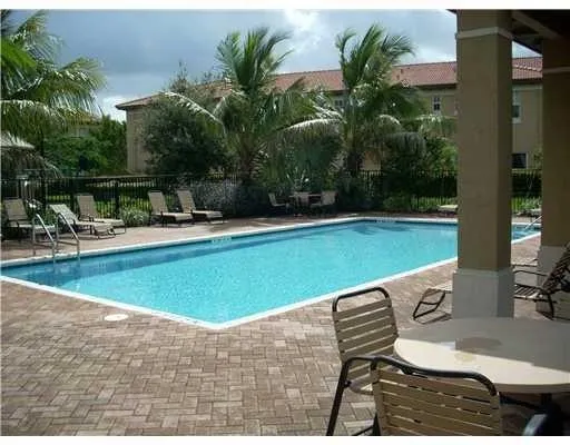 a view of a swimming pool with a lounge chairs