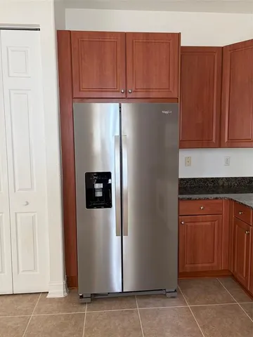 a view of a kitchen with electric appliances