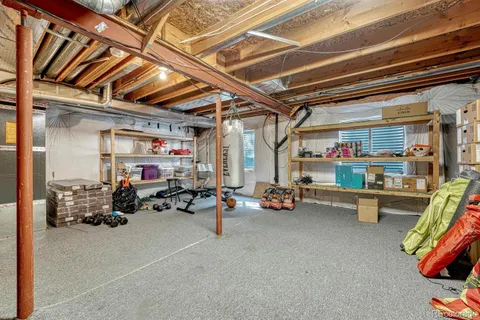 a view of backyard with a huge green area and wooden fence