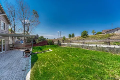 a view of a house with a yard porch and sitting area