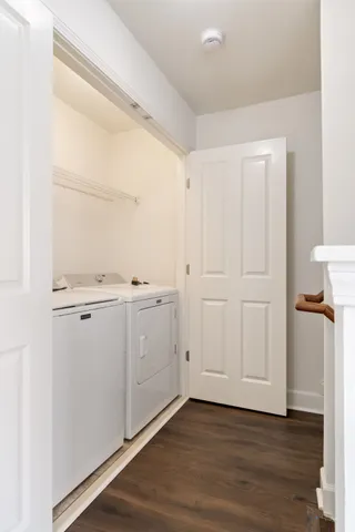 an empty room with wooden floor and a window