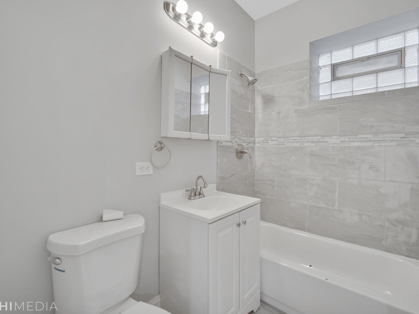6234 South Rhodes Avenue Chicago, IL 60637 - Photo 26 of 36 a bathroom with a sink a toilet and shower